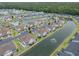 Overhead view of a community with townhomes, canal, mature trees, and landscaping at 8855 Radcliff Dr. Nw # 53D, Calabash, NC 28467