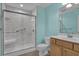 Bathroom features a walk-in shower with a glass enclosure, a wooden vanity, and modern fixtures at 8855 Radcliff Dr. Nw # 53D, Calabash, NC 28467
