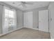 Bedroom with neutral paint, ceiling fan, and natural light from the window at 8855 Radcliff Dr. Nw # 53D, Calabash, NC 28467
