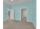 Comfortable bedroom with a doorway leading to other rooms, painted in refreshing aqua hues at 8855 Radcliff Dr. Nw # 53D, Calabash, NC 28467