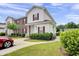 Charming two-story home with red shutters, manicured landscaping, and a concrete walkway at 8855 Radcliff Dr. Nw # 53D, Calabash, NC 28467