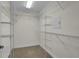 Spacious walk-in closet features wire shelving and a security safe at 8855 Radcliff Dr. Nw # 53D, Calabash, NC 28467