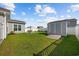 Large backyard with green grass, privacy fence, patio, and storage shed, perfect for entertaining at 924 Sorano St., Myrtle Beach, SC 29579