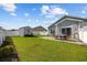 Fenced backyard featuring a patio set and storage shed, perfect for outdoor enjoyment and storage at 924 Sorano St., Myrtle Beach, SC 29579