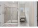 Well-lit bathroom with glass-enclosed shower, vanity with drawers, and a window for natural light at 924 Sorano St., Myrtle Beach, SC 29579