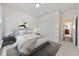 Modern bedroom with neutral color scheme, stylish decor, and a comfortable bed with plush bedding at 924 Sorano St., Myrtle Beach, SC 29579