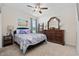 Comfortable bedroom featuring a queen-size bed, a large dresser with a mirror, and soft, neutral tones at 924 Sorano St., Myrtle Beach, SC 29579