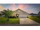 Charming single-Gathering home with well-manicured lawn, two car garage, and grey siding at 924 Sorano St., Myrtle Beach, SC 29579