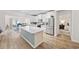 Bright, updated kitchen with stainless steel appliances, large island, and white cabinetry at 924 Sorano St., Myrtle Beach, SC 29579