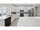 Well-lit kitchen featuring stainless steel appliances, quartz countertops, and modern finishes at 924 Sorano St., Myrtle Beach, SC 29579