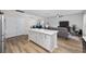 Open kitchen layout with quartz island, and views into living and dining room at 924 Sorano St., Myrtle Beach, SC 29579