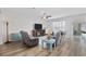 Cozy living room with hardwood floors, comfortable seating, a ceiling fan, and a TV entertainment center at 924 Sorano St., Myrtle Beach, SC 29579