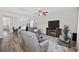 Spacious living room with open concept floor plan, hardwood floors, with entertainment center and comfortable seating at 924 Sorano St., Myrtle Beach, SC 29579