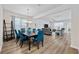Open living area with hardwood flooring, chandelier, and plenty of natural light at 924 Sorano St., Myrtle Beach, SC 29579