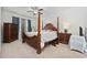 Spacious main bedroom with a four-poster bed, side tables with lamps, and ample natural light at 924 Sorano St., Myrtle Beach, SC 29579