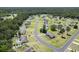 A peaceful community boasting tree-lined streets, a serene pond, and beautiful homes with private pools at 95 Timber Run Dr., Georgetown, SC 29440