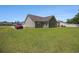 Large, landscaped backyard with patio and ample space for outdoor activities at 95 Timber Run Dr., Georgetown, SC 29440