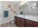 Bathroom featuring a white vanity top, matching cabinets, and a shower with a glass door at 95 Timber Run Dr., Georgetown, SC 29440