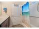 Bathroom featuring a beach themed shower curtain, white shower stall, and a decorative mirror at 95 Timber Run Dr., Georgetown, SC 29440