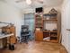 A cozy bedroom with a TV, ceiling fan and interesting wood-look floors at 95 Timber Run Dr., Georgetown, SC 29440