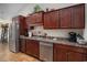 Spacious kitchen with stainless steel appliances, dark wood cabinets, and modern countertops at 95 Timber Run Dr., Georgetown, SC 29440