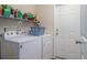 Functional laundry room with washer, dryer, and ample shelving for storage at 95 Timber Run Dr., Georgetown, SC 29440