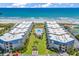 Breathtaking aerial view features condo buildings with a courtyard, pool, and beachside access at 9660 Shore Dr. # 208, Myrtle Beach, SC 29572