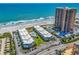 Scenic aerial view of the beachfront condos, pool, tennis court, and ocean at 9660 Shore Dr. # 208, Myrtle Beach, SC 29572