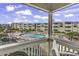 Balcony with view of the community pool area and multiple buildings at 9660 Shore Dr. # 208, Myrtle Beach, SC 29572