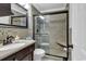 Well-lit bathroom with a glass-enclosed shower, tiled walls, and a sleek vanity at 9660 Shore Dr. # 208, Myrtle Beach, SC 29572