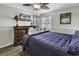Comfortable bedroom featuring a dresser, ceiling fan, and TV for relaxation at 9660 Shore Dr. # 208, Myrtle Beach, SC 29572
