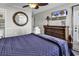 Relaxing bedroom featuring a large bed, wooden dresser, and ceiling fan at 9660 Shore Dr. # 208, Myrtle Beach, SC 29572