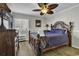 Comfortable bedroom with a ceiling fan, dresser, and a bed with soft bedding at 9660 Shore Dr. # 208, Myrtle Beach, SC 29572