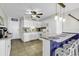 Kitchen with seating at the countertop, featuring white appliances and tile floors at 9660 Shore Dr. # 208, Myrtle Beach, SC 29572