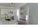 Bright kitchen featuring white cabinets, modern countertops, and a large island at Tbd Park St., Georgetown, SC 29440