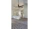 Spacious living room with wood floors, a ceiling fan, and bright, airy windows at Tbd Park St., Georgetown, SC 29440