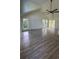 Spacious living room with wood floors, a ceiling fan, and bright, airy windows at Tbd Park St., Georgetown, SC 29440