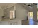 Bright living room with wood floors and high ceilings, flooded with natural light at Tbd Park St., Georgetown, SC 29440