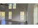 Bright living room with wood floors and high ceilings, flooded with natural light at Tbd Park St., Georgetown, SC 29440
