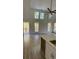 Open-concept living room features vaulted ceilings, large windows, and wood-look flooring at Tbd Park St., Georgetown, SC 29440