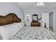Bedroom with carpet, ceiling fan, and decorative wood frame bed at 113-A Vista Dr., Garden City Beach, SC 29576