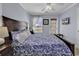 Bedroom with carpet, ceiling fan, and a large bed with seashell accents at 113-A Vista Dr., Garden City Beach, SC 29576