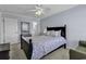 Bedroom featuring a ceiling fan, bed and furniture with neutral toned walls and carpet at 113-A Vista Dr., Garden City Beach, SC 29576