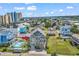 Stunning multi-story beach house with balconies, and a swimming pool, nestled in a vibrant coastal community at 113-A Vista Dr., Garden City Beach, SC 29576