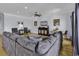 Spacious living room featuring a comfortable sectional sofa, a media center, and elegant decor at 113-A Vista Dr., Garden City Beach, SC 29576