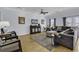 Bright living room featuring hardwood floors, stylish furniture, and plenty of natural light at 113-A Vista Dr., Garden City Beach, SC 29576