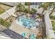 Overhead view of kidney bean-shaped pool surrounded by lounge chairs and lush tropical landscaping at 113-A Vista Dr., Garden City Beach, SC 29576