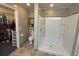 Bathroom featuring walk-in closet, toilet, and a shower with tile surround at 125 Gavin Hill Ct., Aynor, SC 29511