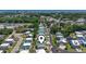 Aerial shot of neighborhood showcasing houses, mature trees, and proximity to the ocean at 128 Lake Pointe Dr., Murrells Inlet, SC 29576