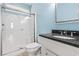 Well-lit bathroom with a glass enclosed shower and granite countertop vanity at 128 Lake Pointe Dr., Murrells Inlet, SC 29576